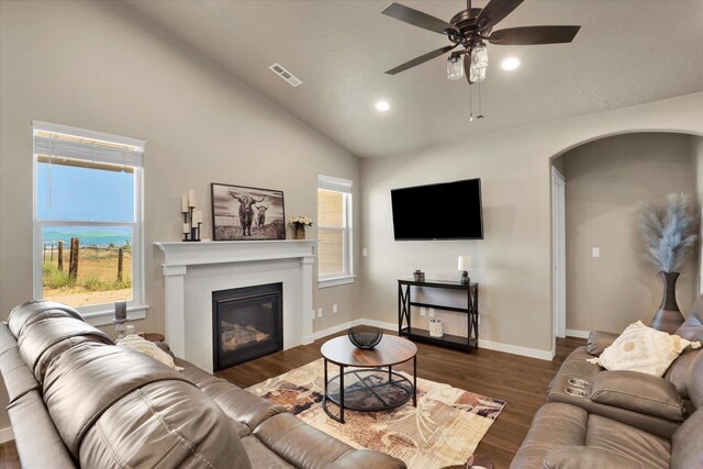 18381 E 17th Ave, Greenacres, WA 99016 - living area with dark wood-style floors, recessed lighting, ceiling fan, a glass covered fireplace, and healthy amount of natural light