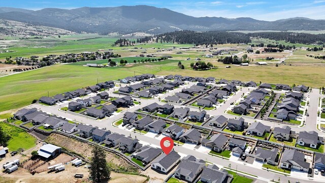 18381 E 17th Ave, Greenacres, WA 99016 - aerial view of property and surrounding area featuring nearby suburban area and a mountainous background