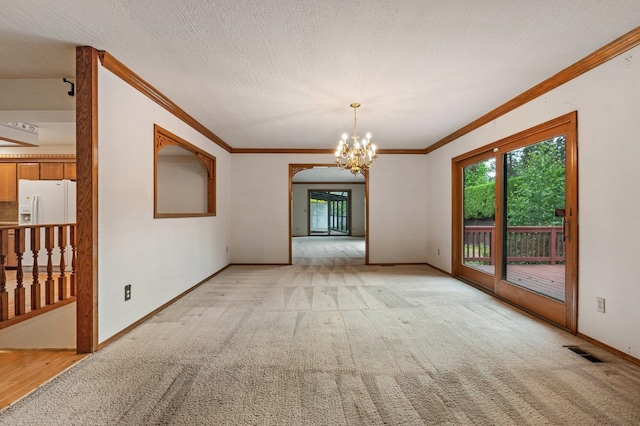 1621 E 65th Ave, Spokane, WA 99223 - empty room featuring ornamental molding, a chandelier, and light carpet
