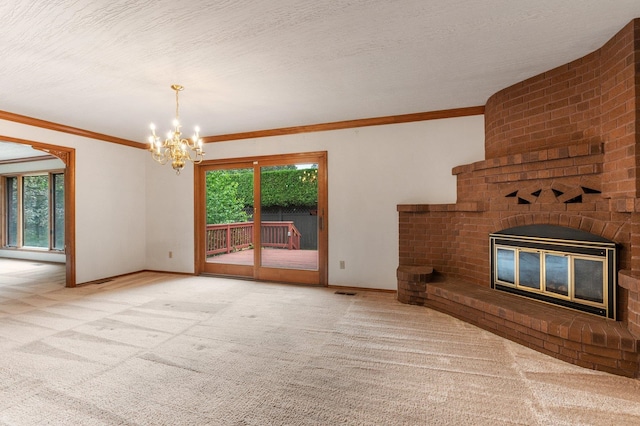 1621 E 65th Ave, Spokane, WA 99223 - unfurnished living room featuring carpet, a chandelier, a brick fireplace, and ornamental molding