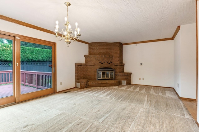 1621 E 65th Ave, Spokane, WA 99223 - unfurnished living room with a chandelier, crown molding, a brick fireplace, and carpet floors