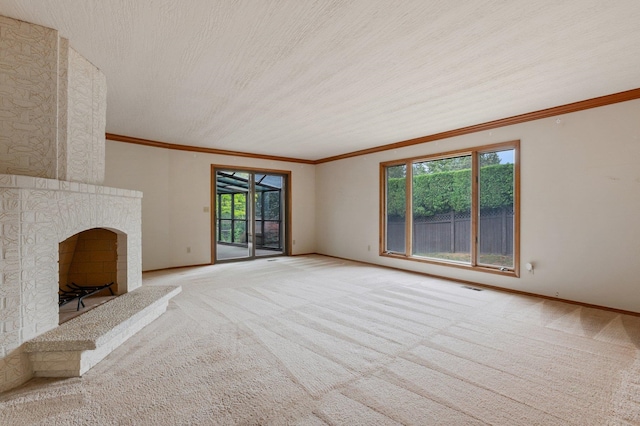 1621 E 65th Ave, Spokane, WA 99223 - unfurnished living room with light colored carpet, a fireplace, and ornamental molding