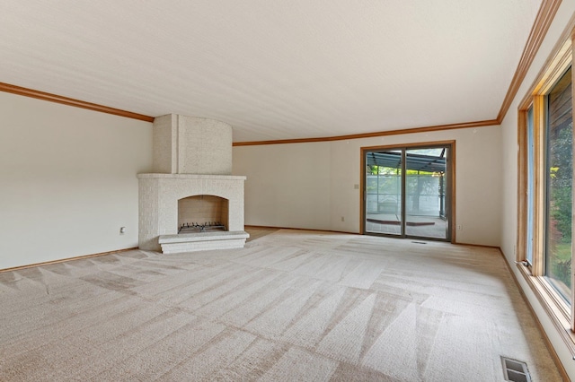 1621 E 65th Ave, Spokane, WA 99223 - unfurnished living room featuring light carpet, crown molding, plenty of natural light, and a fireplace