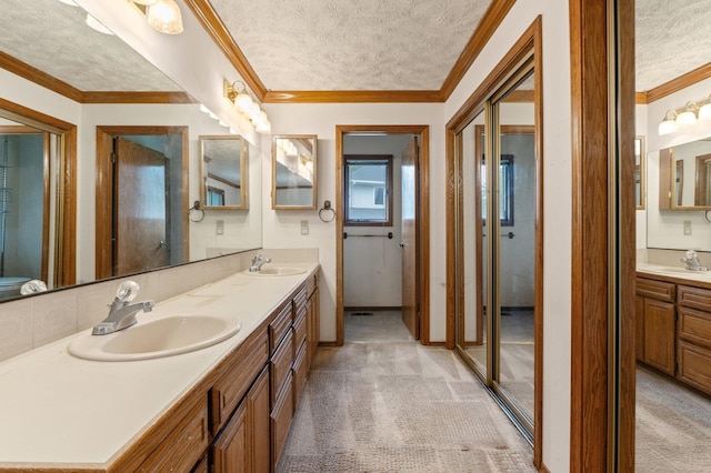 1621 E 65th Ave, Spokane, WA 99223 - full bathroom featuring a textured ceiling, double vanity, and ornamental molding