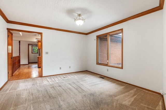 1621 E 65th Ave, Spokane, WA 99223 - spare room with light carpet and crown molding