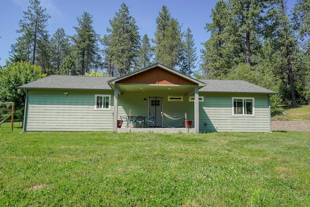 38823 N Newport Hwy, Elk, WA 99009 - rear view of house with a yard, a patio, and roof with shingles