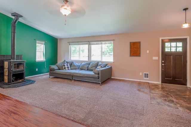 38823 N Newport Hwy, Elk, WA 99009 - carpeted living area with a wood stove, vaulted ceiling, and a ceiling fan