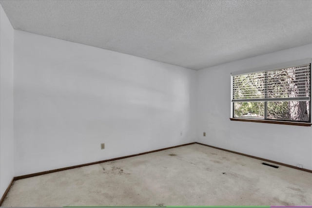 4717 S Skipworth Rd, Spokane Valley, WA 99206 - carpeted empty room featuring a textured ceiling and baseboards
