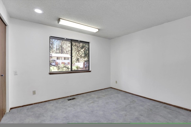 4717 S Skipworth Rd, Spokane Valley, WA 99206 - spare room featuring carpet, a textured ceiling, and recessed lighting