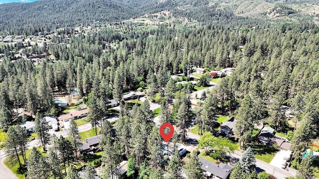 4717 S Skipworth Rd, Spokane Valley, WA 99206 - aerial view of property and surrounding area with a heavily wooded area and a mountainous background