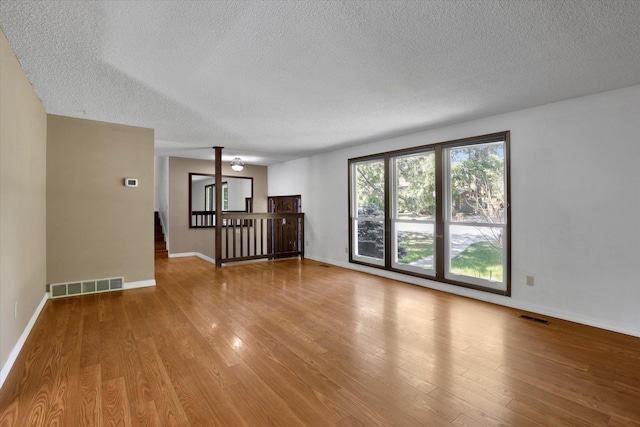 4717 S Skipworth Rd, Spokane Valley, WA 99206 - empty room with a textured ceiling and wood finished floors