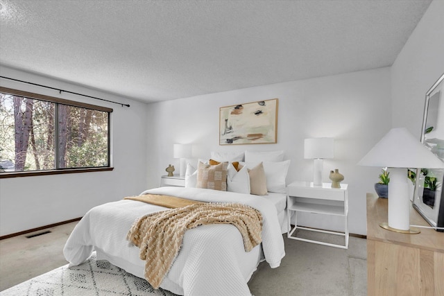 4717 S Skipworth Rd, Spokane Valley, WA 99206 - carpeted bedroom with baseboards and a textured ceiling