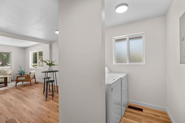 1501 N Lily Rd, Spokane, WA 99212 - laundry area with independent washer and dryer and light wood-type flooring