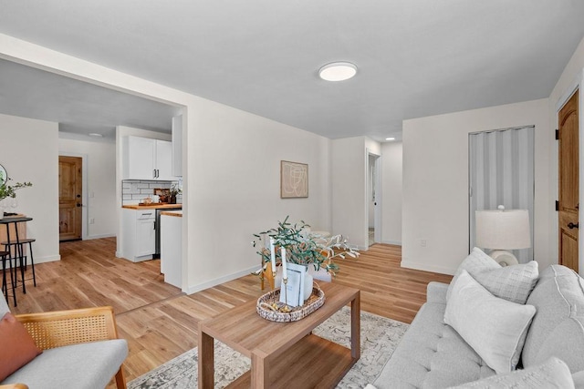 1501 N Lily Rd, Spokane, WA 99212 - living area featuring baseboards and light wood-style flooring