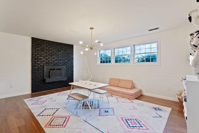 4118 S Stone St, Spokane, WA 99223 - living area with wood finished floors and a chandelier