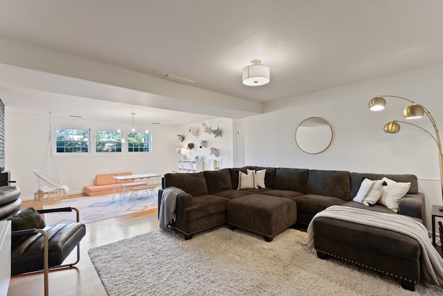4118 S Stone St, Spokane, WA 99223 - living area with light wood finished floors and a chandelier