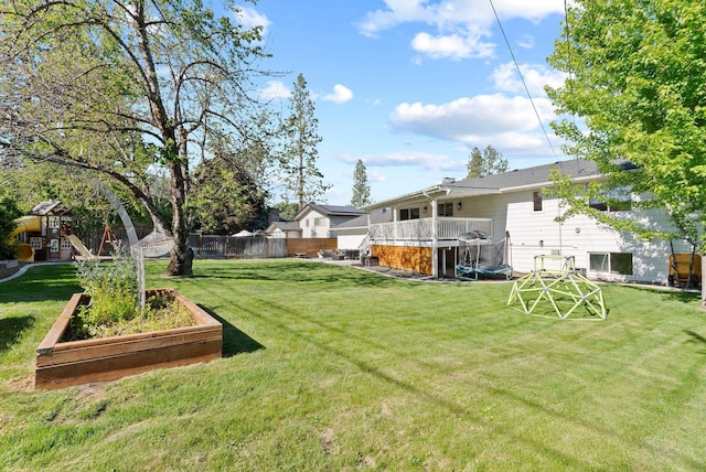 4118 S Stone St, Spokane, WA 99223 - view of yard with a playground, a trampoline, and a vegetable garden