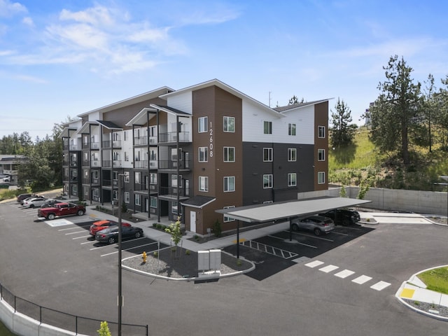 12608 E Nora Ave, Spokane Valley, WA 99216 - view of apartment building / complex featuring uncovered parking