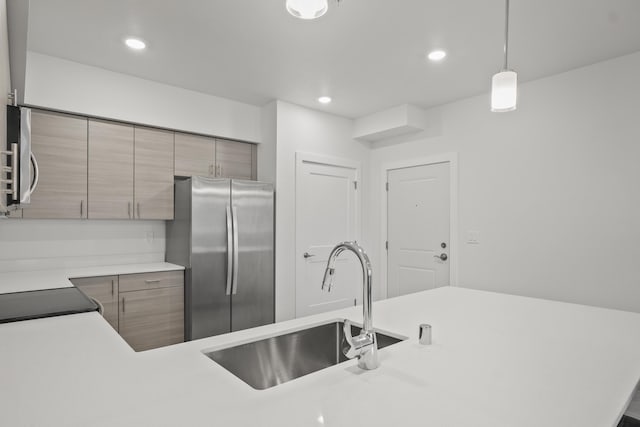 12608 E Nora Ave, Spokane Valley, WA 99216 - kitchen with stainless steel appliances, light countertops, hanging light fixtures, recessed lighting, and modern cabinets