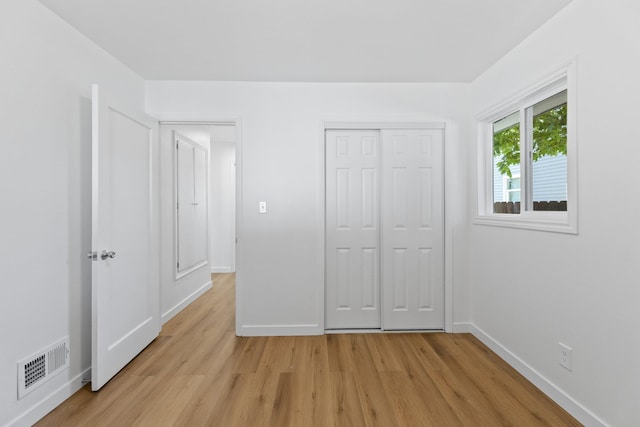 3927 E Fairview Ave, Spokane, WA 99217 - unfurnished bedroom featuring light wood-type flooring and a closet