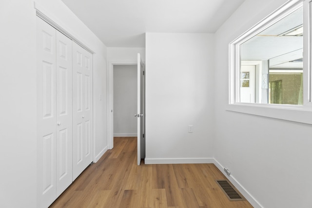 3927 E Fairview Ave, Spokane, WA 99217 - unfurnished bedroom featuring light wood finished floors and a closet