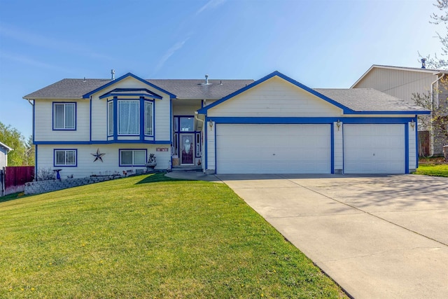 15204 N Chesapeake Rd, Mead, WA 99021 - tri-level home with a garage, concrete driveway, and a front yard