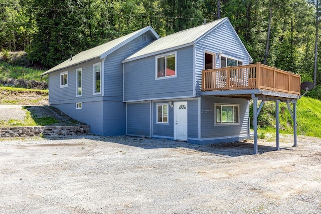 337 Lehigh Hill Rd, Metaline Falls, WA 99153 - view of front of house featuring a deck and a wooded view