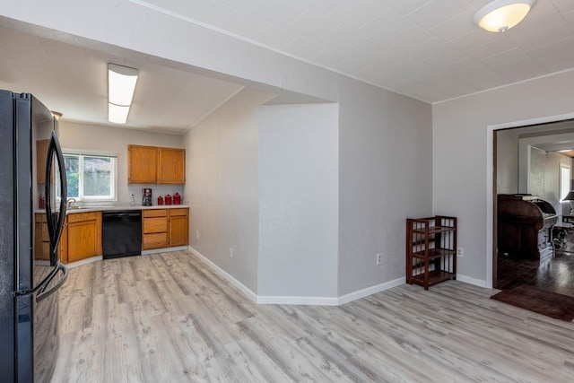 337 Lehigh Hill Rd, Metaline Falls, WA 99153 - kitchen with black appliances, light wood-style flooring, brown cabinetry, and light countertops