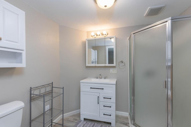 337 Lehigh Hill Rd, Metaline Falls, WA 99153 - full bath featuring vanity, a stall shower, and wood finished floors