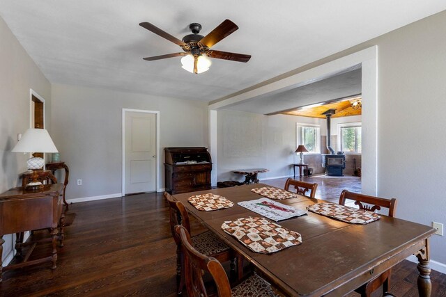 337 Lehigh Hill Rd, Metaline Falls, WA 99153 - dining space featuring a wood stove, ceiling fan, and wood finished floors