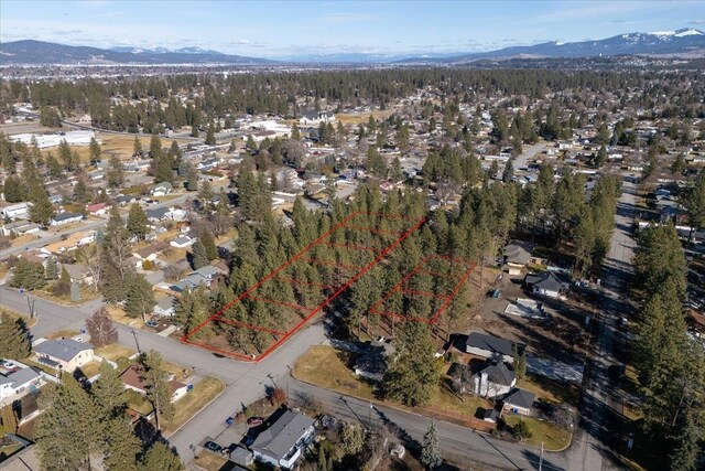11206 E 27th Ave Lot 10, Spokane Valley, WA 99206 - aerial view of property and surrounding area with mountains and property parcel outlined
