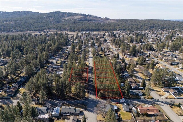 11206 E 27th Ave Lot 10, Spokane Valley, WA 99206 - aerial perspective of suburban area with a forest and mountains