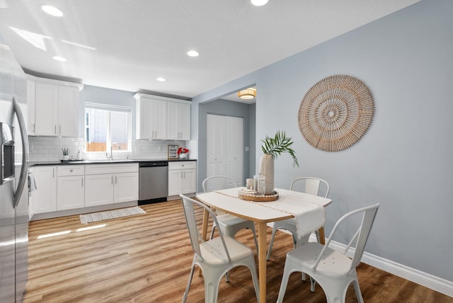 1010 E Montgomery Ave, Spokane, WA 99207 - dining space with light wood-type flooring and recessed lighting