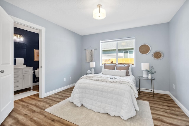 1010 E Montgomery Ave, Spokane, WA 99207 - bedroom with wood finished floors and ensuite bath