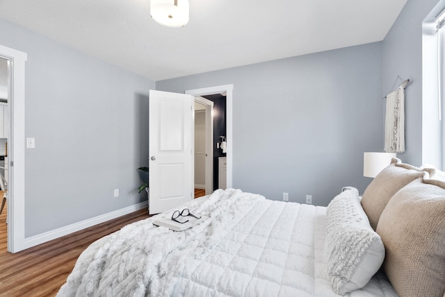 1010 E Montgomery Ave, Spokane, WA 99207 - bedroom with wood finished floors and baseboards