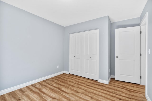 1010 E Montgomery Ave, Spokane, WA 99207 - unfurnished bedroom with light wood-type flooring and a closet
