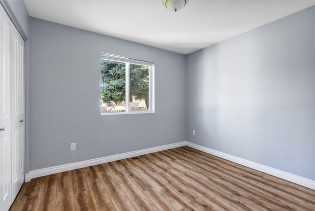 1010 E Montgomery Ave, Spokane, WA 99207 - empty room featuring wood finished floors and baseboards