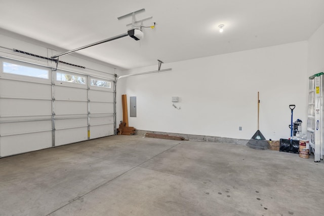1010 E Montgomery Ave, Spokane, WA 99207 - garage featuring electric panel and a garage door opener