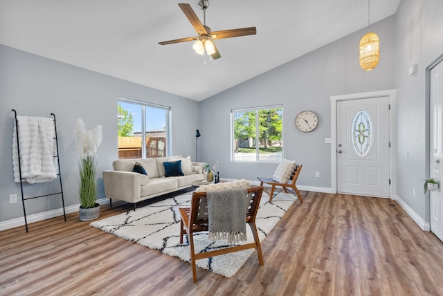 1010 E Montgomery Ave, Spokane, WA 99207 - living area with wood finished floors, plenty of natural light, ceiling fan, and high vaulted ceiling