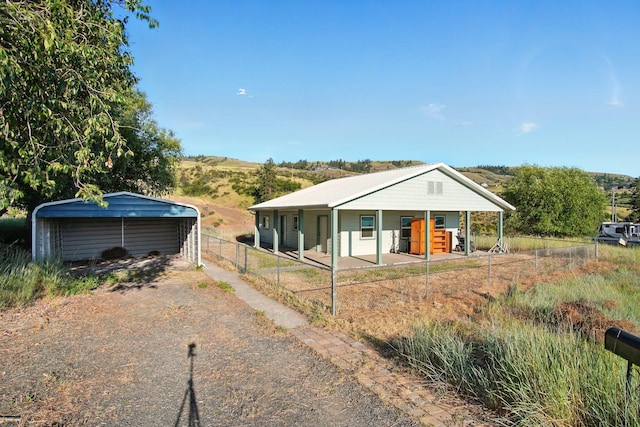 41450 Sunday Bay Rd N, Deer Meadows, WA 99122 - view of front of house featuring a carport, covered porch, and driveway