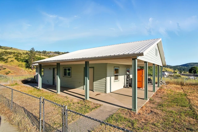 41450 Sunday Bay Rd N, Deer Meadows, WA 99122 - back of property featuring a metal roof and a mountain view
