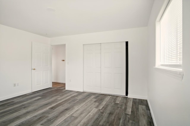 41450 Sunday Bay Rd N, Deer Meadows, WA 99122 - unfurnished bedroom with wood finished floors and a closet