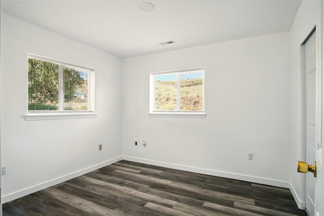 41450 Sunday Bay Rd N, Deer Meadows, WA 99122 - unfurnished bedroom featuring dark wood-style floors and baseboards