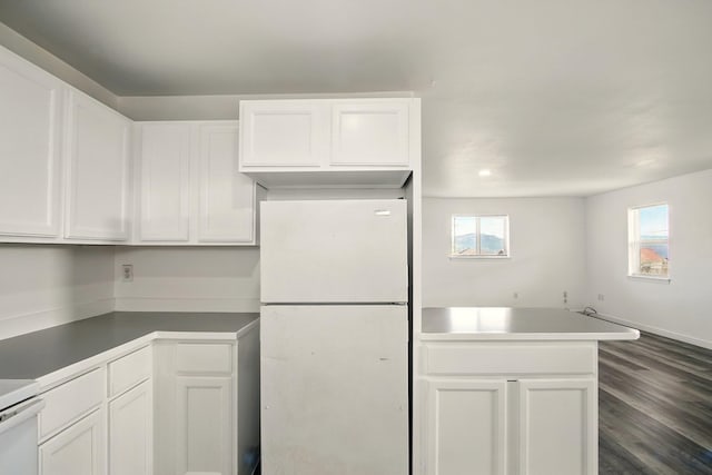 41450 Sunday Bay Rd N, Deer Meadows, WA 99122 - kitchen featuring freestanding refrigerator, white cabinets, dark wood-type flooring, and recessed lighting