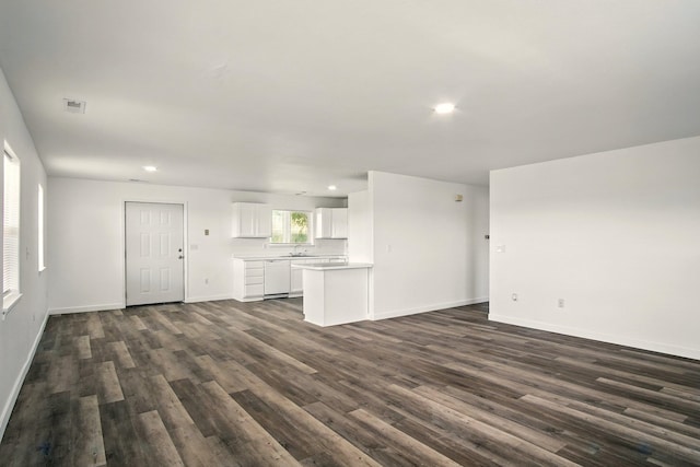 41450 Sunday Bay Rd N, Deer Meadows, WA 99122 - unfurnished living room featuring dark wood-style flooring and recessed lighting