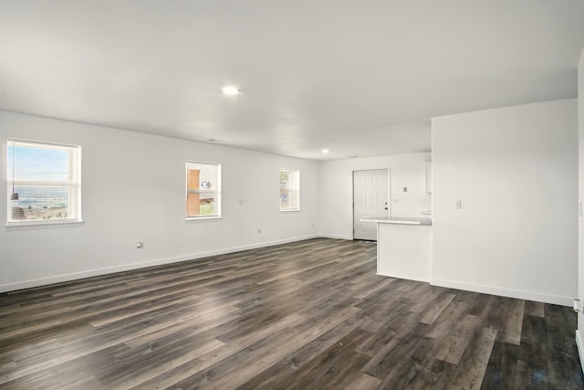 41450 Sunday Bay Rd N, Deer Meadows, WA 99122 - unfurnished living room featuring dark wood finished floors and recessed lighting