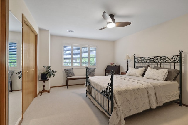 7802 E Timber Ridge Ln, Spokane Valley, WA 99212 - bedroom with light colored carpet, a ceiling fan, and a closet