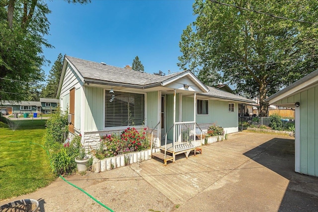10904 E 26th Ave, Spokane, WA 99206 - view of front facade with a front lawn and covered porch