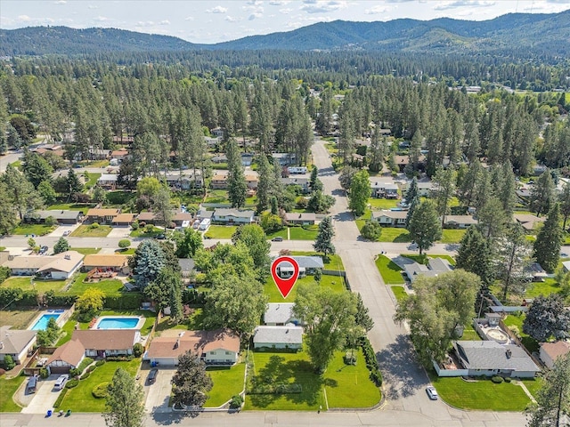 10904 E 26th Ave, Spokane, WA 99206 - aerial overview of property's location with mountains and nearby suburban area