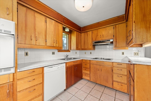 10904 E 26th Ave, Spokane, WA 99206 - kitchen with white appliances, under cabinet range hood, backsplash, and light countertops